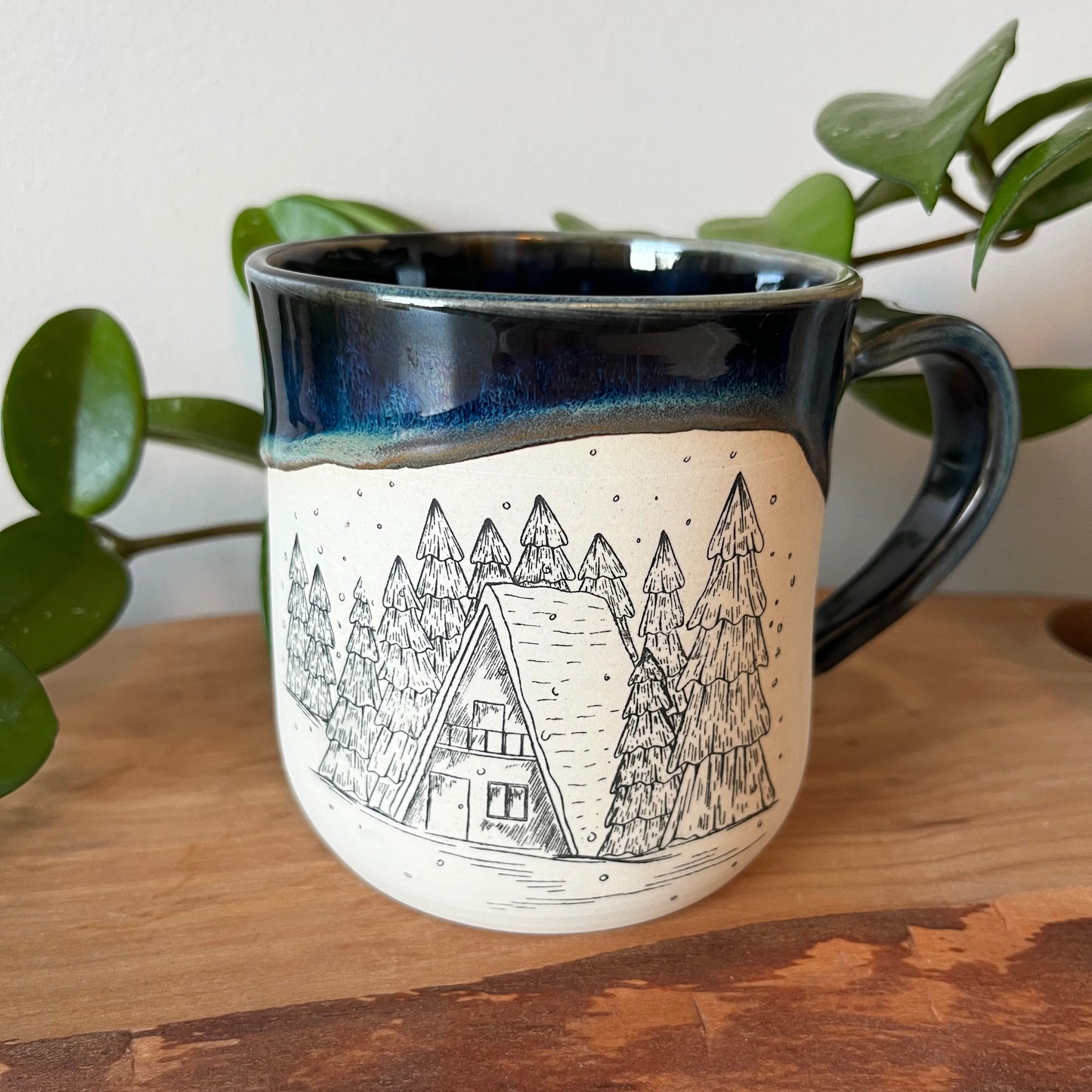 Northern Lights Mug with Snowy Cabin